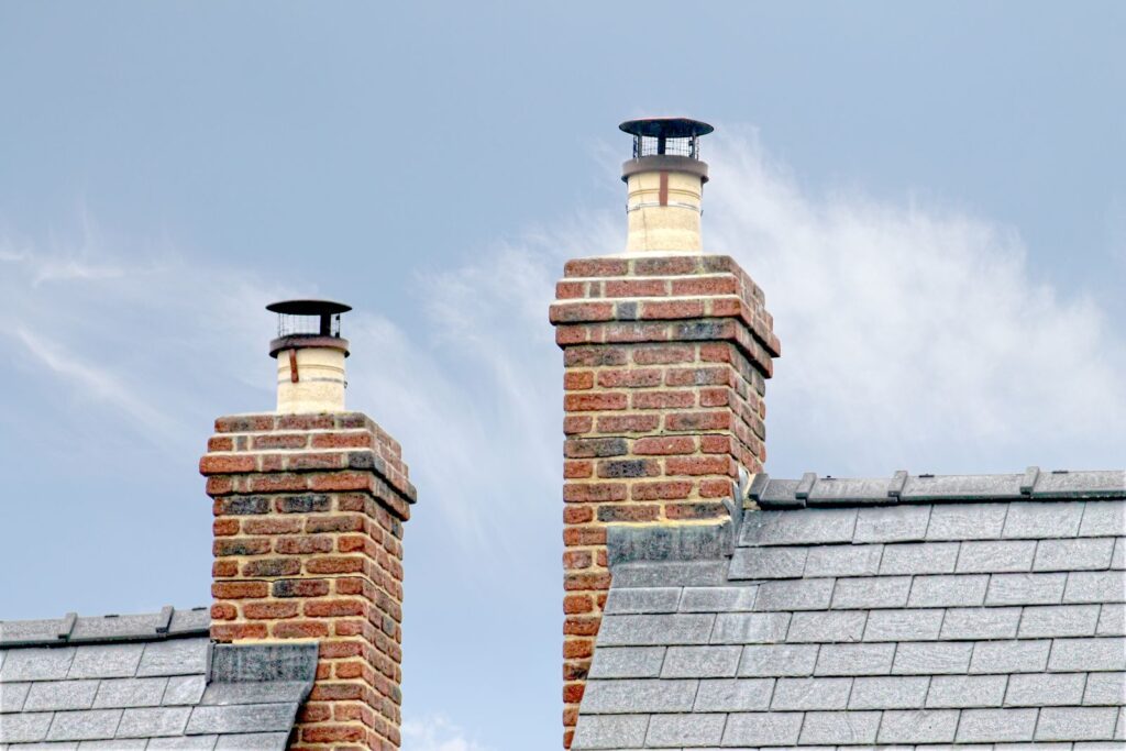 Brick chimneys on a slate roof after service, SEO for chimney companies by Websza