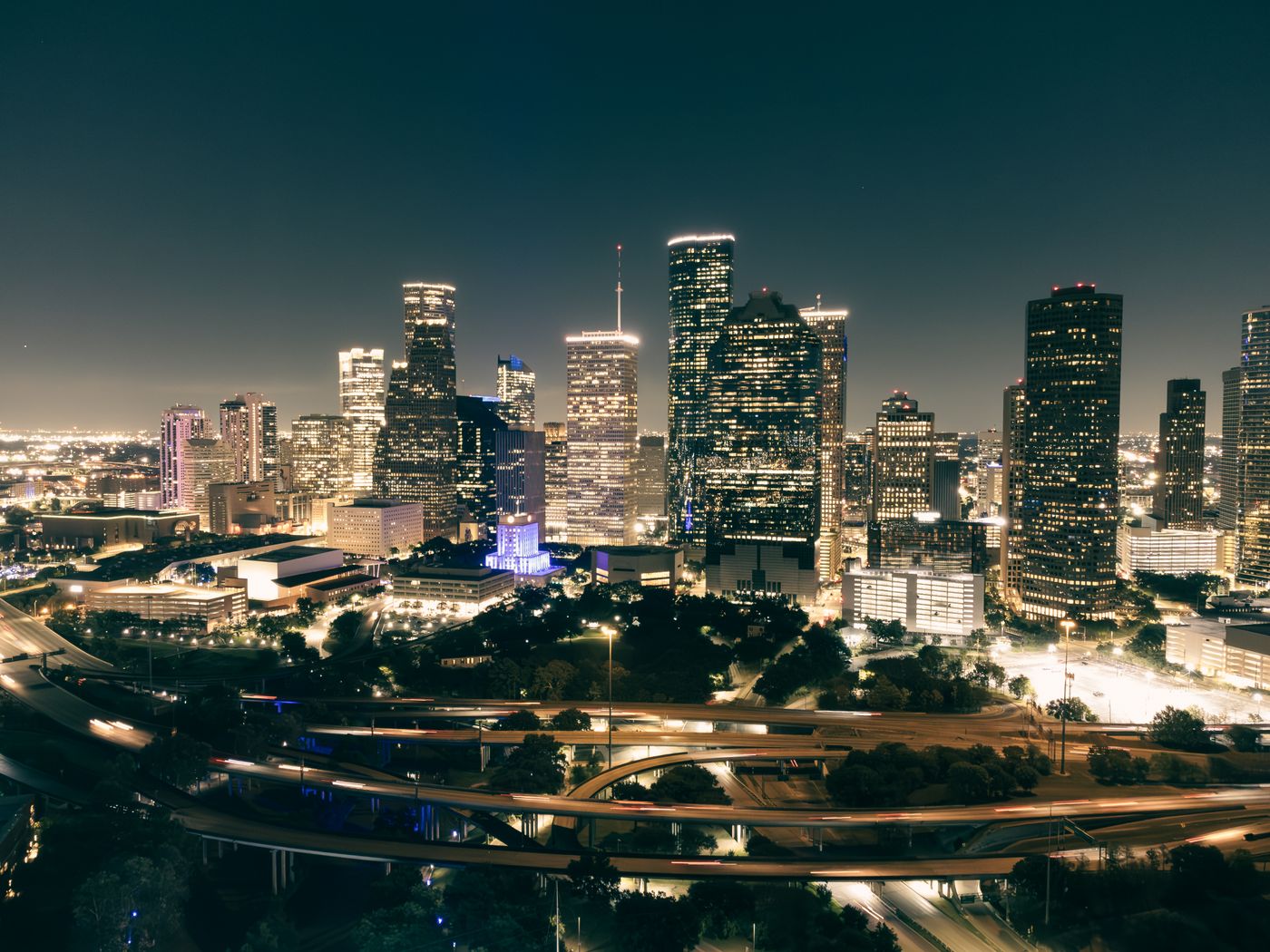 Downtown Houston illuminated at night - Houston SEO results for local businesses