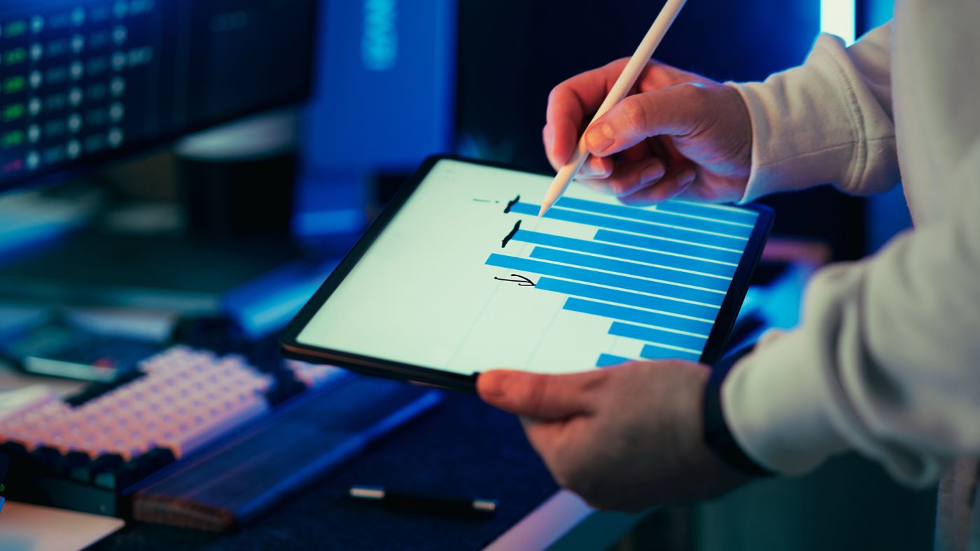 Tablet displaying business growth charts - digital marketing results for contractors