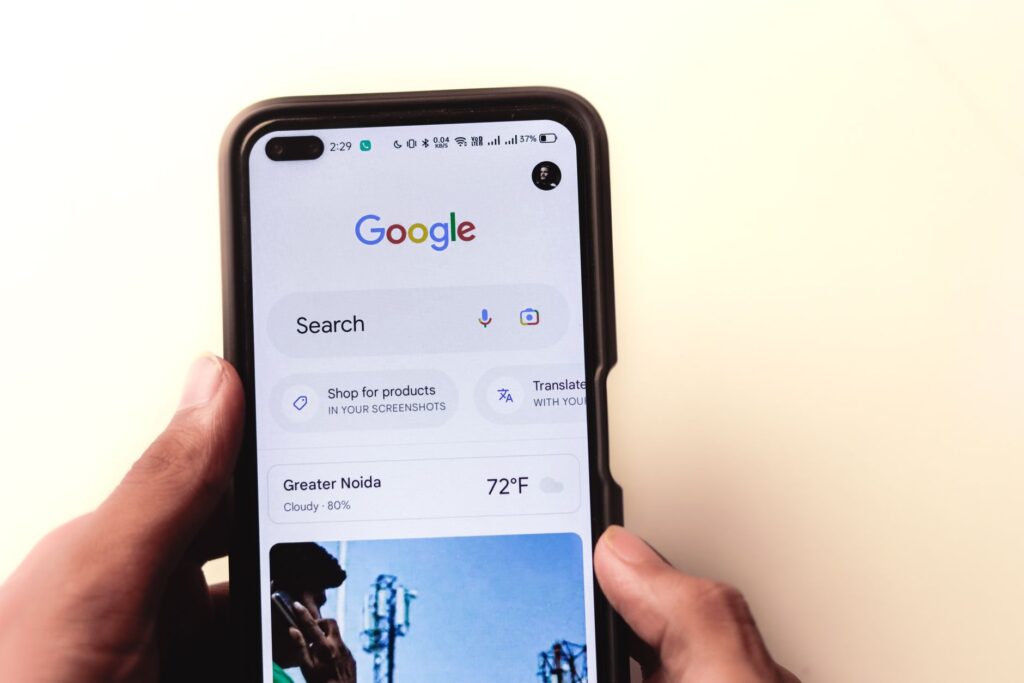 Contractor searching Google Local Services Ads on a smartphone to explore LSA marketing opportunities