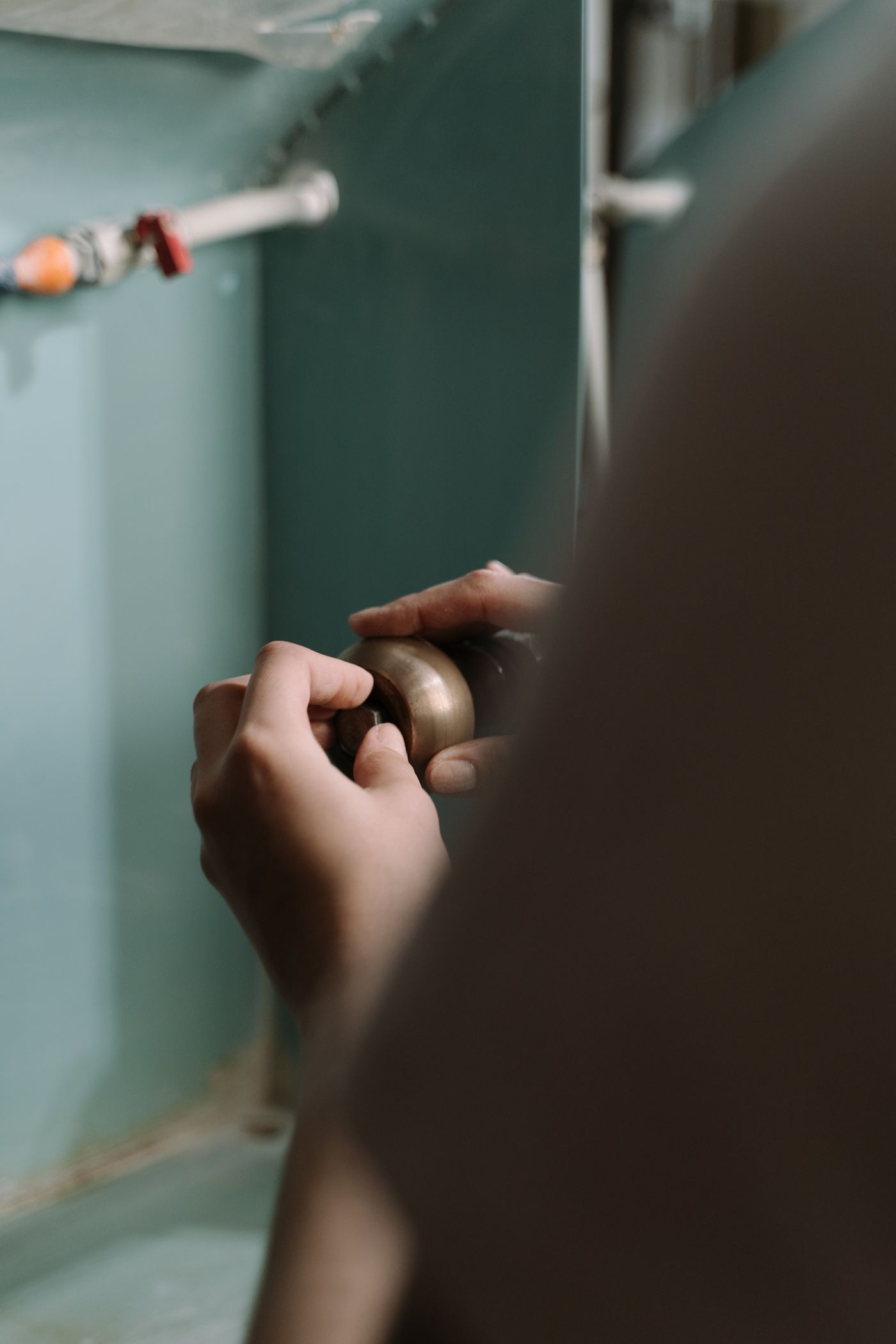 Plumber fixing a kitchen sink drain — SEO results for plumbing companies