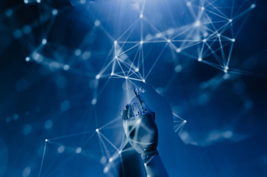 Robotic hand connecting to a digital network representing AI agent automation technology powering modern business workflows